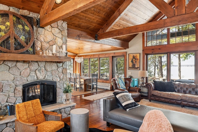 8434 Big Whitefish Narrows, Pine River, MN 56474 - living area featuring plenty of natural light, wooden ceiling, a stone fireplace, and hardwood / wood-style floors