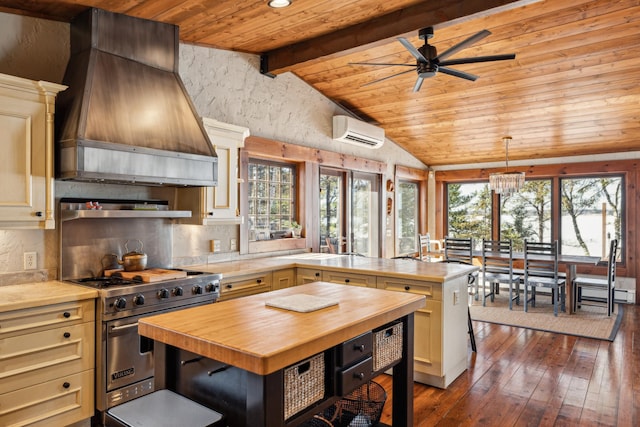 8434 Big Whitefish Narrows, Pine River, MN 56474 - kitchen with premium range hood, premium range, butcher block counters, vaulted ceiling with beams, and a wall unit AC
