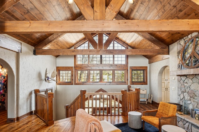 8434 Big Whitefish Narrows, Pine River, MN 56474 - dining area featuring arched walkways, vaulted ceiling with beams, and plenty of natural light
