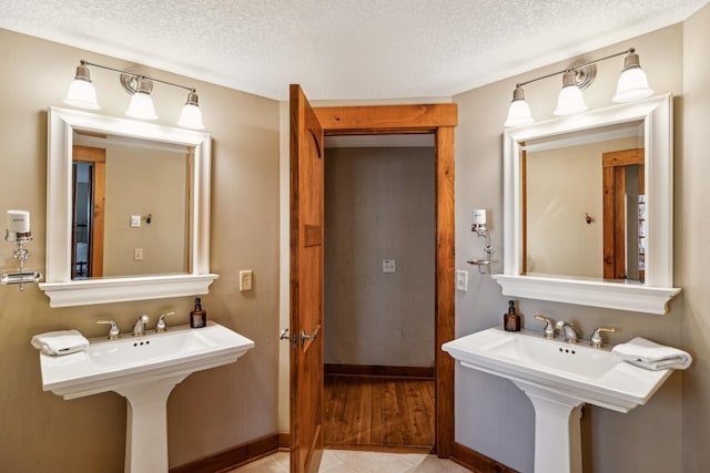 8434 Big Whitefish Narrows, Pine River, MN 56474 - bathroom featuring a textured ceiling, baseboards, and tile patterned floors