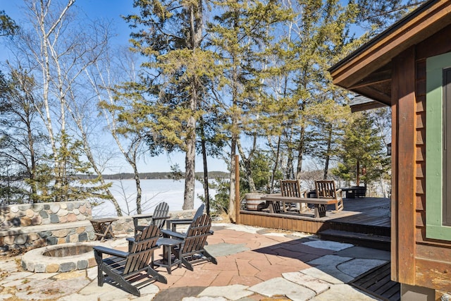 8434 Big Whitefish Narrows, Pine River, MN 56474 - view of patio / terrace featuring a deck with water view and an outdoor fire pit
