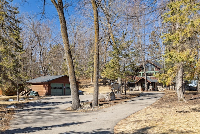8434 Big Whitefish Narrows, Pine River, MN 56474 - chalet / cabin featuring aphalt driveway, an outbuilding, and a detached garage