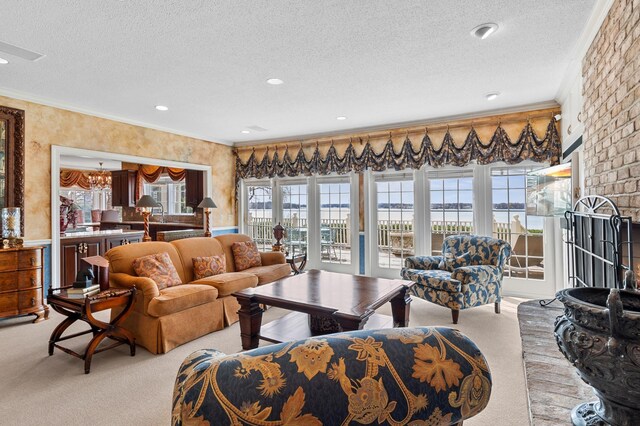 living room featuring a water view, ornamental molding, light carpet, and a textured ceiling