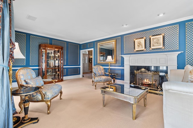 carpeted living area featuring crown molding, a premium fireplace, and wallpapered walls