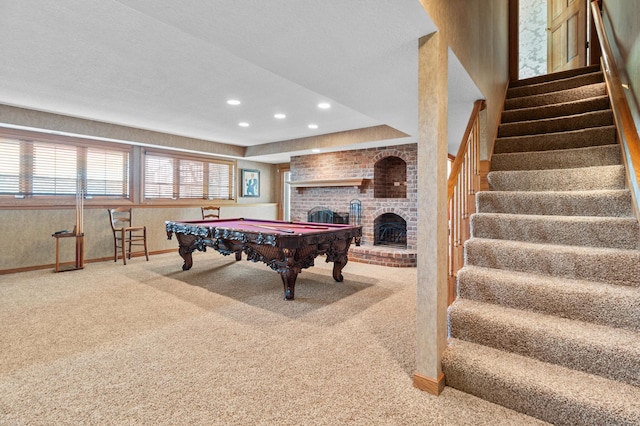 game room featuring baseboards, carpet flooring, billiards, and a brick fireplace