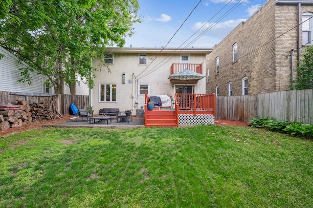 716 6th St NE, Minneapolis, MN 55413 - back of property with a balcony, stucco siding, a deck, a patio, and an outdoor living space with a fire pit