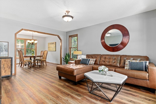 12534 Dover Dr, Apple Valley, MN 55124 - living room with a chandelier, healthy amount of natural light, and wood finished floors