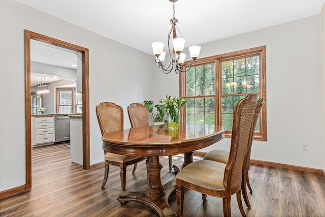12534 Dover Dr, Apple Valley, MN 55124 - dining room with a chandelier and dark wood-type flooring