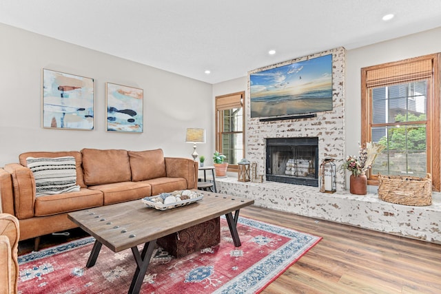 12534 Dover Dr, Apple Valley, MN 55124 - living room with wood finished floors, a fireplace, and recessed lighting