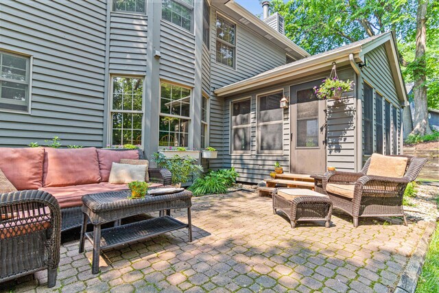 12534 Dover Dr, Apple Valley, MN 55124 - view of patio / terrace with an outdoor hangout area and a sunroom