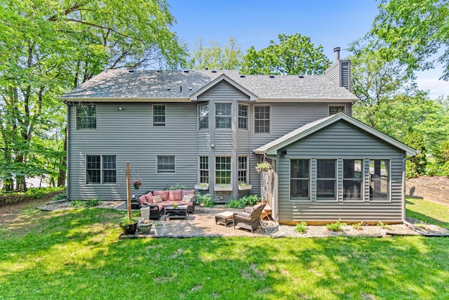 12534 Dover Dr, Apple Valley, MN 55124 - back of property with outdoor lounge area, a patio, a chimney, and a yard