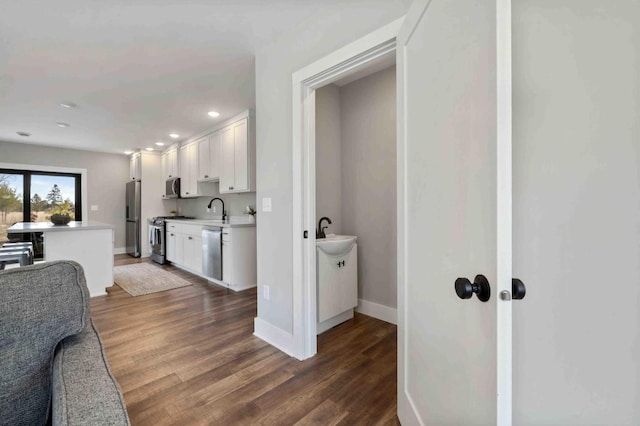 2737 Golfview Dr SW, Pine River Twp, MN 56474 - hall with dark wood-style floors, a sink, baseboards, and recessed lighting