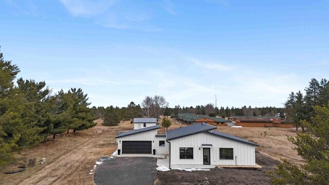 2737 Golfview Dr SW, Pine River Twp, MN 56474 - view of front of property with board and batten siding, a garage, and driveway