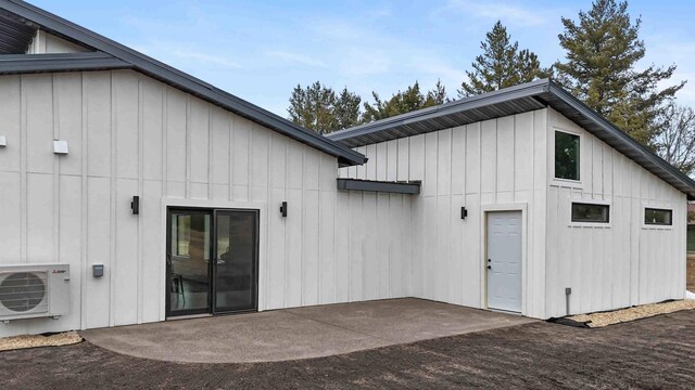 2737 Golfview Dr SW, Pine River Twp, MN 56474 - back of house with a cooling unit, board and batten siding, and a patio