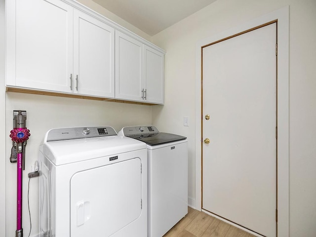 1883 County Road C E, Maplewood, MN 55109 - laundry room with independent washer and dryer, cabinet space, and light wood-style flooring