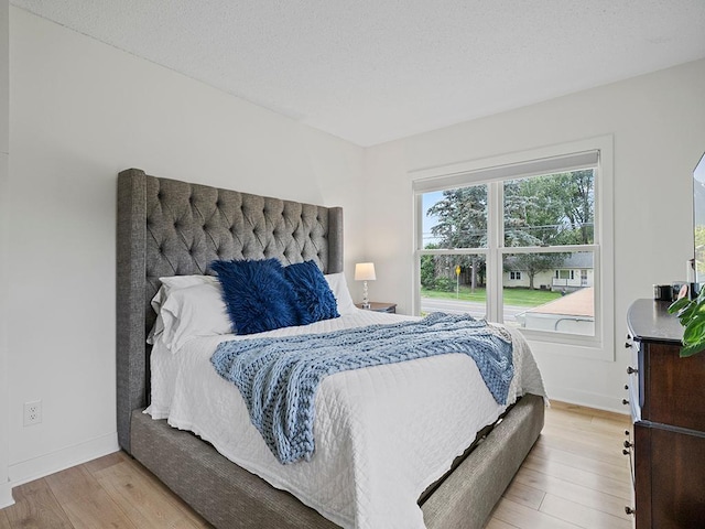1883 County Road C E, Maplewood, MN 55109 - bedroom with wood finished floors and baseboards