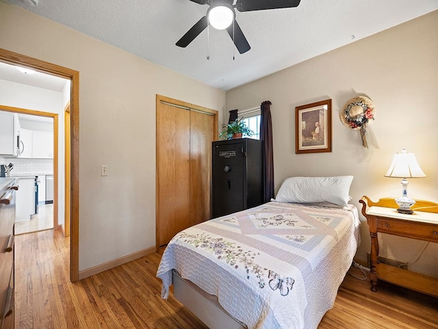 1883 County Road C E, Maplewood, MN 55109 - bedroom featuring light wood finished floors, a closet, and a ceiling fan