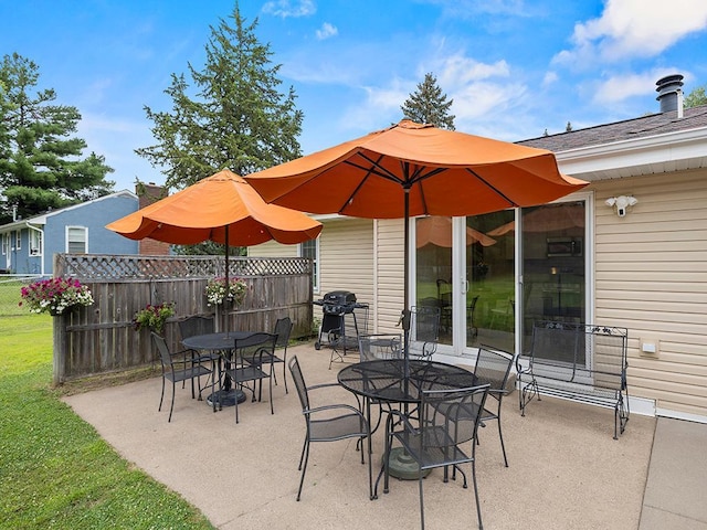 1883 County Road C E, Maplewood, MN 55109 - view of patio with a grill and outdoor dining space