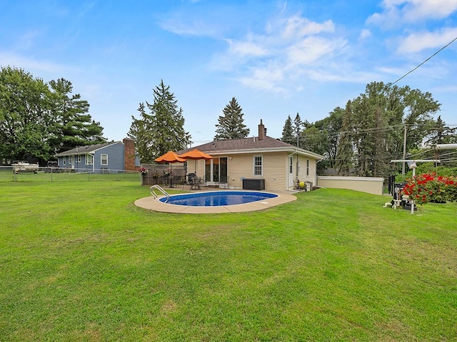 1883 County Road C E, Maplewood, MN 55109 - back of property featuring a fenced backyard, a chimney, and a patio