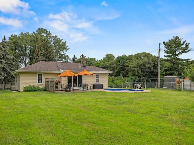 1883 County Road C E, Maplewood, MN 55109 - rear view of house with a fenced backyard, a patio, and a chimney