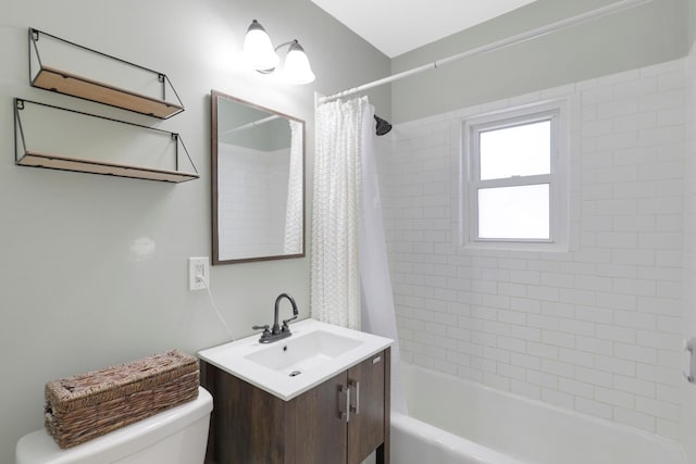bathroom with toilet, vanity, and shower / bath combo with shower curtain