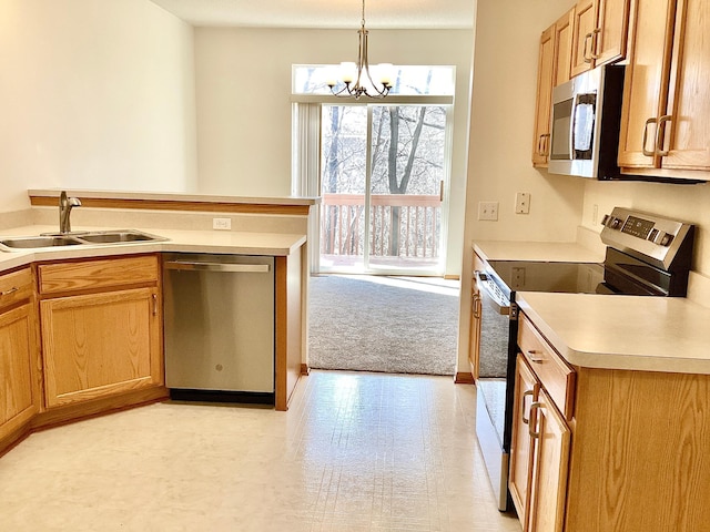 16873 79th Ave N, Maple Grove, MN 55311 - kitchen featuring stainless steel appliances, a sink, a chandelier, decorative light fixtures, and light countertops