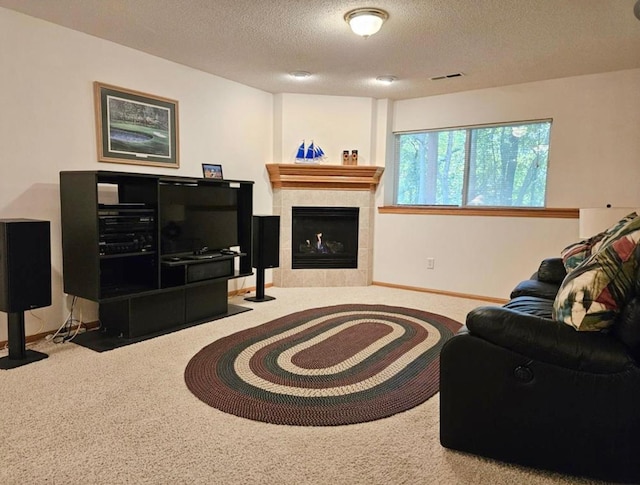 16873 79th Ave N, Maple Grove, MN 55311 - carpeted living room with a textured ceiling, baseboards, and a tiled fireplace