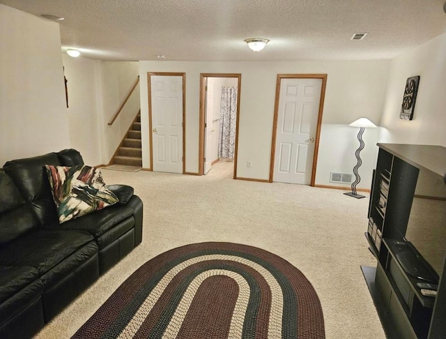 16873 79th Ave N, Maple Grove, MN 55311 - carpeted living room with stairs, a textured ceiling, and baseboards