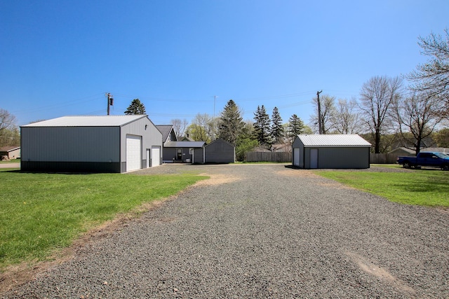 view of road featuring gravel driveway