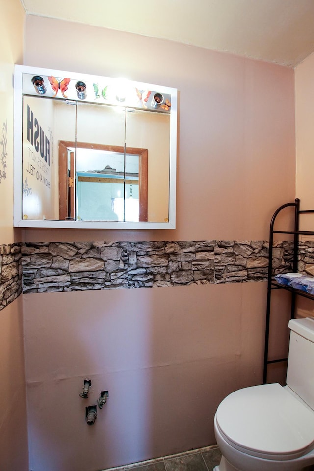 half bath featuring toilet