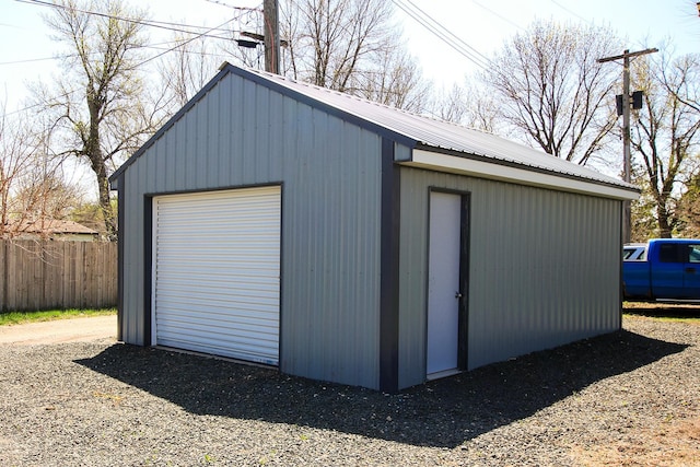 view of outbuilding with an outbuilding and fence