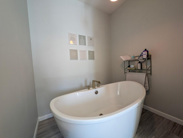 36861 477th Ave, Otto Twp, MN 56567 - full bathroom featuring baseboards and a freestanding tub