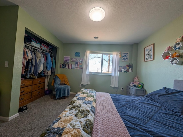 36861 477th Ave, Otto Twp, MN 56567 - bedroom with carpet floors, a textured ceiling, and a closet