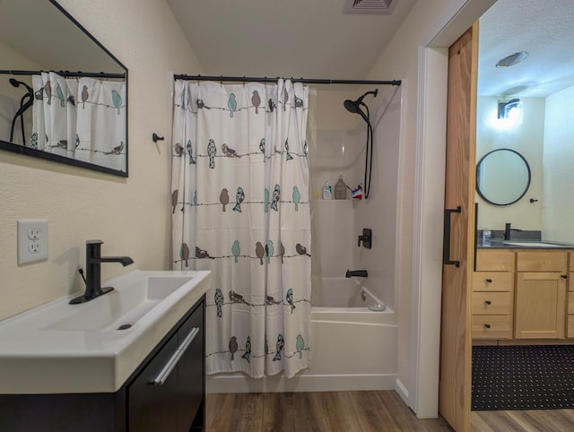 36861 477th Ave, Otto Twp, MN 56567 - full bath with wood finished floors, shower / bath combination with curtain, and vanity