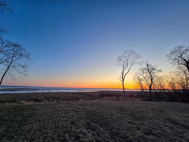 36861 477th Ave, Otto Twp, MN 56567 - yard at dusk with a water view