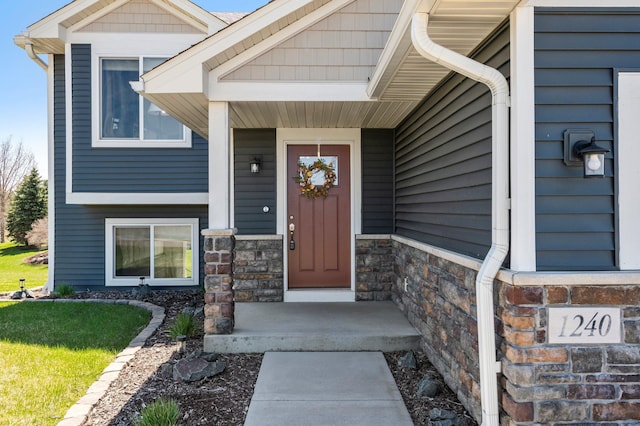 view of exterior entry with stone siding