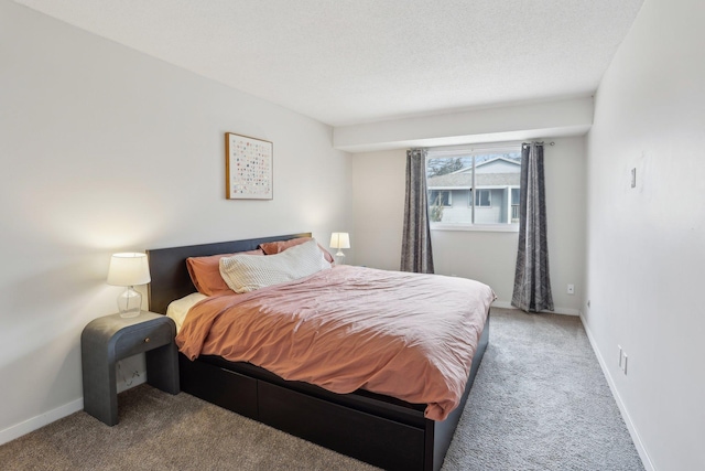 bedroom featuring carpet flooring and baseboards