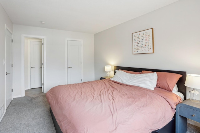 carpeted bedroom with baseboards
