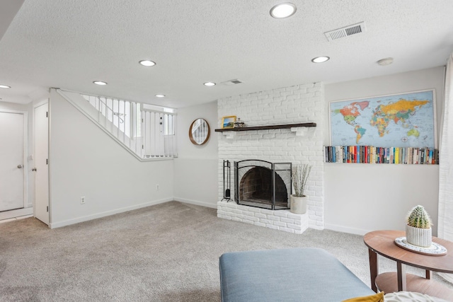 carpeted living area featuring stairway, recessed lighting, a textured ceiling, and a fireplace