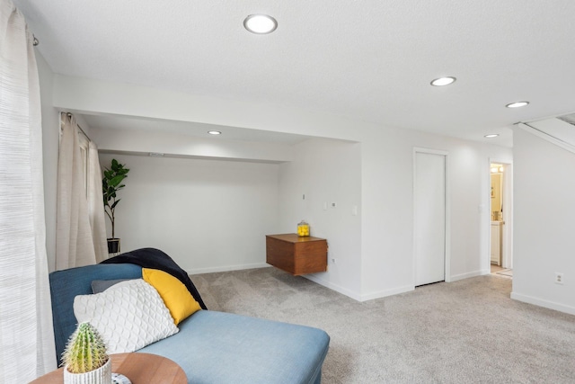 living area with recessed lighting, carpet, and baseboards