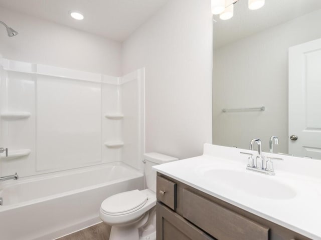 539 Winkler Trl N, Cologne, MN 55322 - full bath featuring toilet, vanity, wood finished floors, and shower / bathtub combination