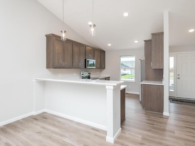 539 Winkler Trl N, Cologne, MN 55322 - kitchen featuring light wood-type flooring, recessed lighting, a peninsula, light countertops, and stainless steel appliances