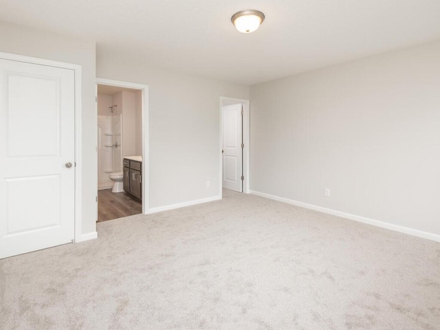 539 Winkler Trl N, Cologne, MN 55322 - unfurnished bedroom with carpet flooring, baseboards, and connected bathroom