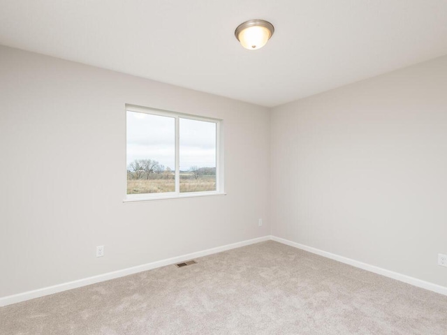 539 Winkler Trl N, Cologne, MN 55322 - spare room featuring carpet flooring, visible vents, and baseboards