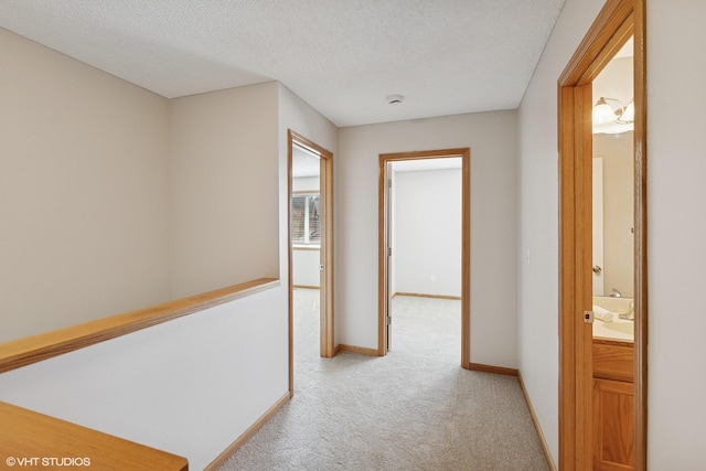 128 Oakmont Ln, Red Wing, MN 55066 - hallway featuring light carpet, baseboards, and a textured ceiling
