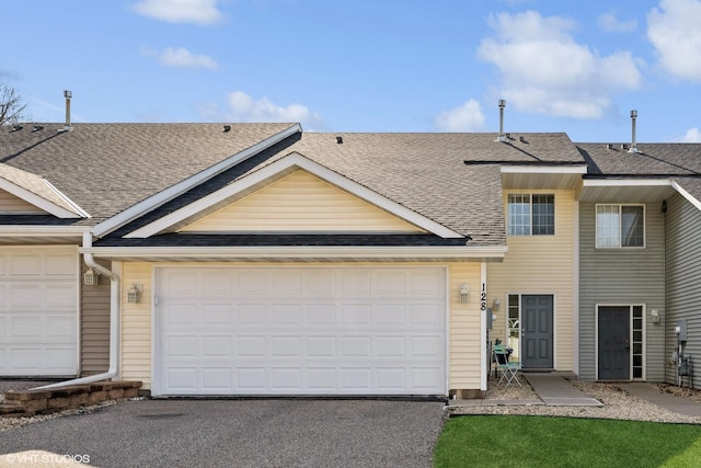128 Oakmont Ln, Red Wing, MN 55066 - multi unit property featuring a shingled roof, driveway, and an attached garage