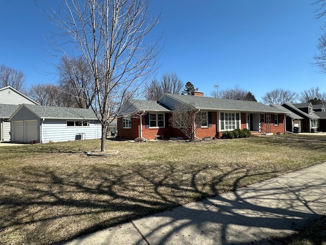 single story home with a front yard, a garage, brick siding, an outdoor structure, and a chimney