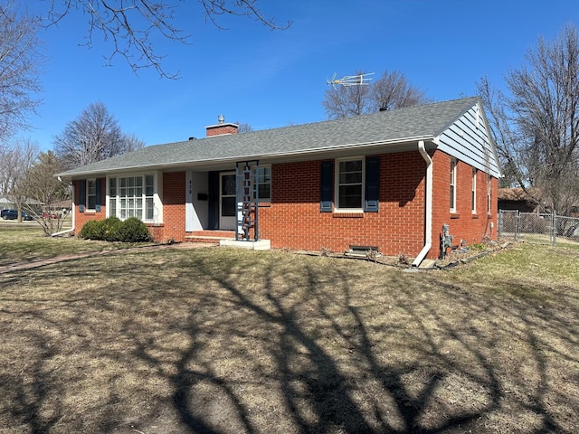 single story home with a front yard, fence, a chimney, and brick siding