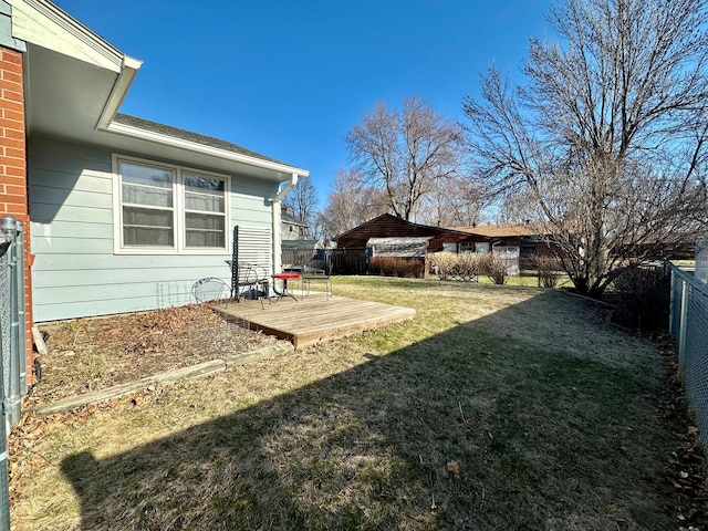 view of yard with a deck and a fenced backyard