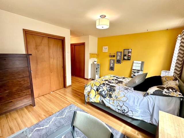 bedroom with a closet and wood finished floors